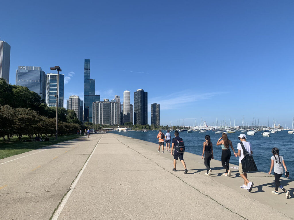 People walking along the Chicago waterfront - one of the cool things to do in Chicago!
