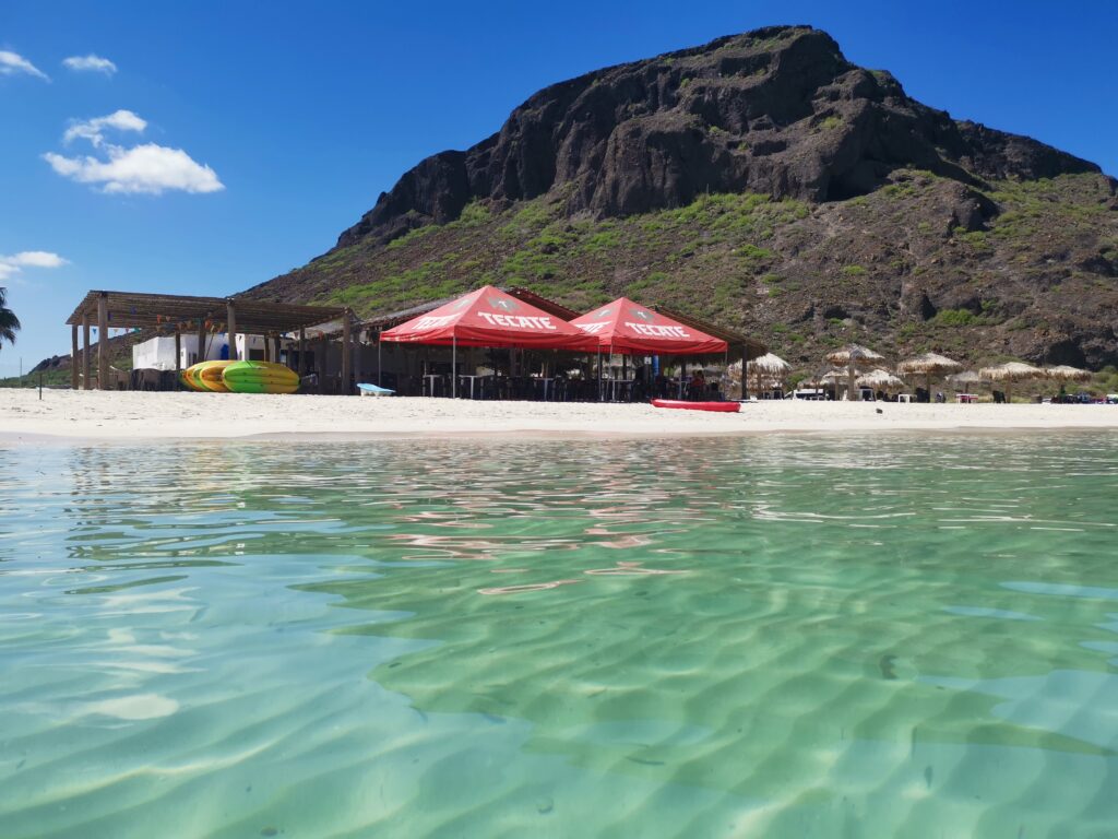 Restaurant and clear water at Playa Tecolote