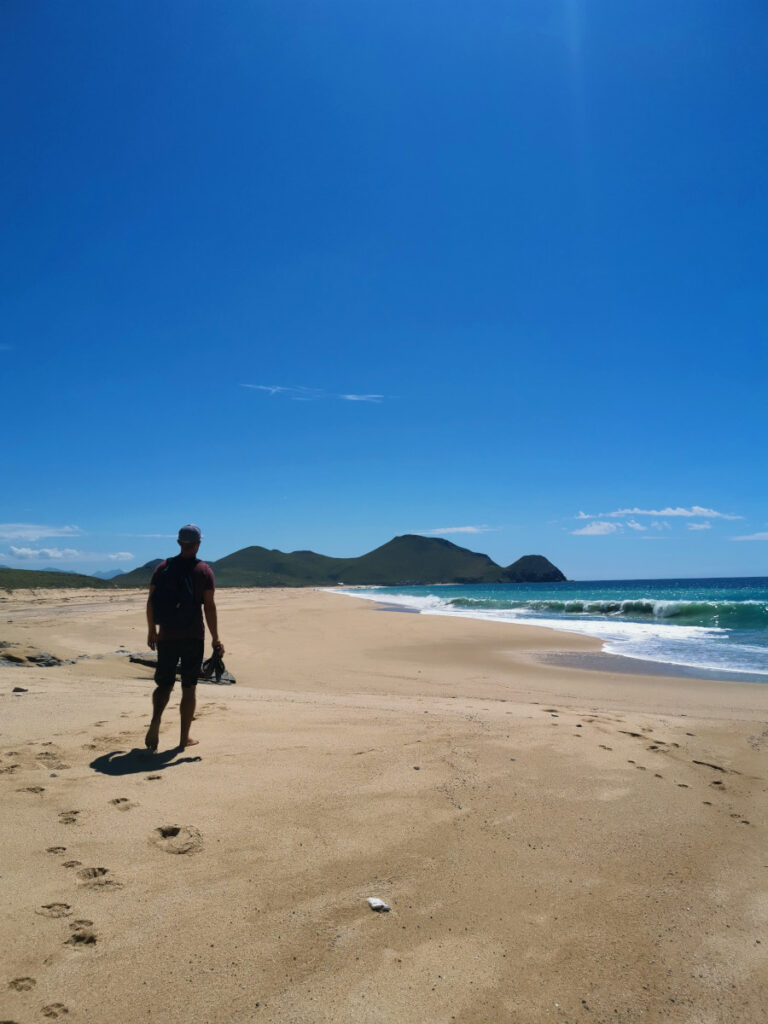 Walking on the beach near Todos Santos Meico towards the lighthouse