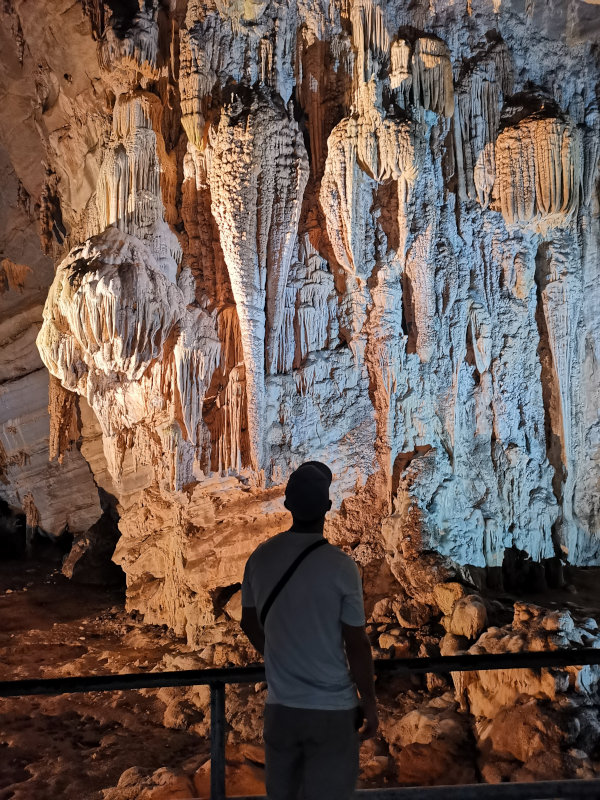 Allan looking up at formations inside the Grutas de Cacahuamilpa