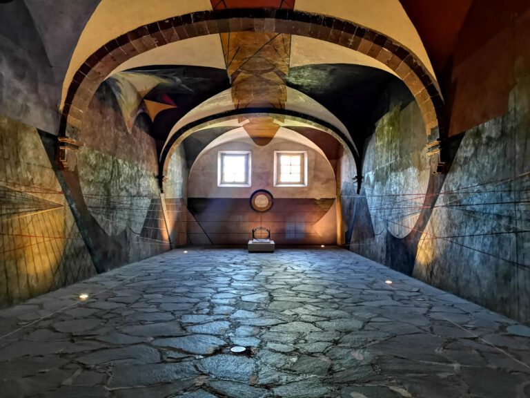 Inisde an art room full of dark murals - one of the unusual things to do in San Miguel de Allende
