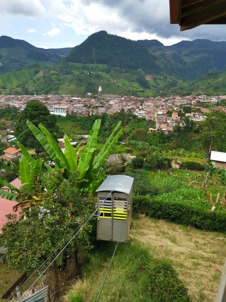 Jardin cable car hanging above town on a rope