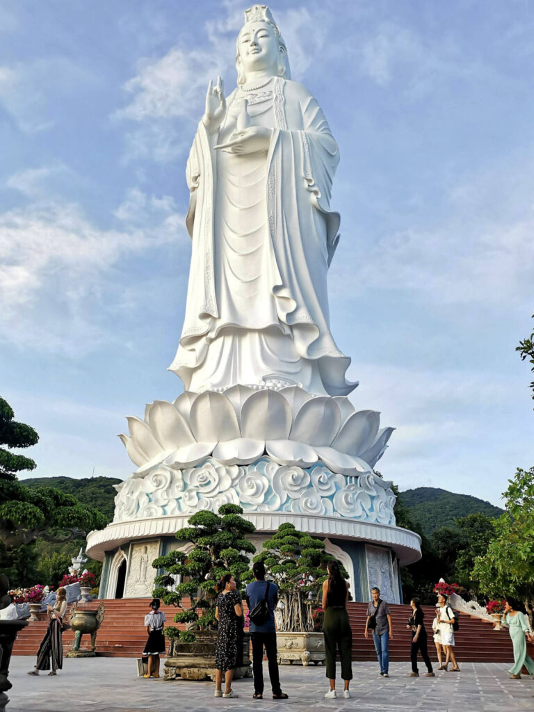 People standing in front of the Lady Buddha statue in Da Nang, Vietnam