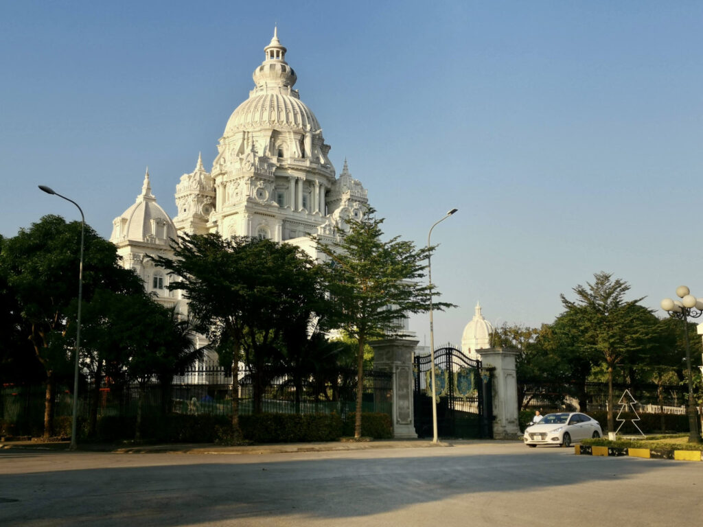 A large, ornate European-style building with a white dome and intricate details, located on the side of a road in Ninh Binh city.