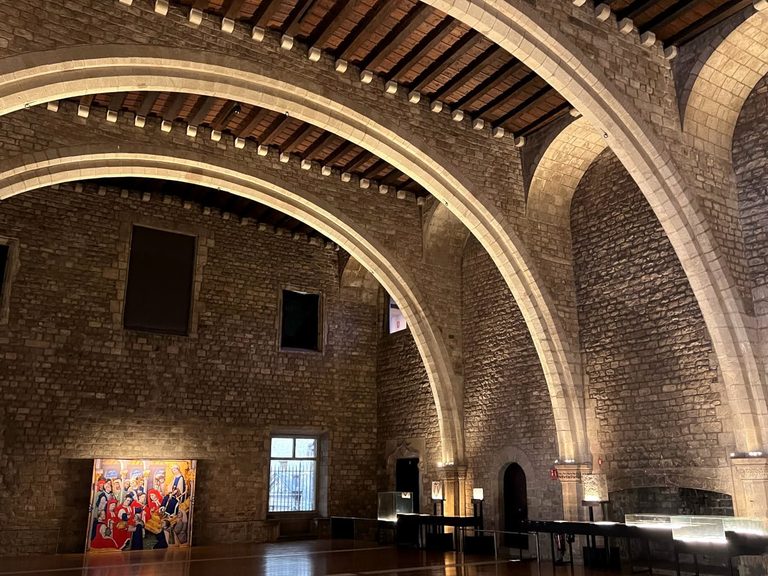 Sweeping stone diaphragm arches supporting the wooden ceiling of the Saló del Tinell inside MUHBA Museu d'Història de Barcelona, one of the best museums to visit for free every Sunday from 3 pm or every first Sunday of the month.
